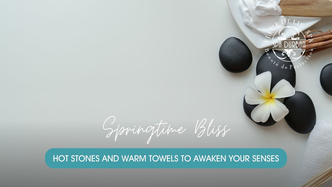 Flatlay of spa essentials including black hot stones, white flower, cinnamon sticks, and cream on a white background, promoting rejuvenating spa packages for spring