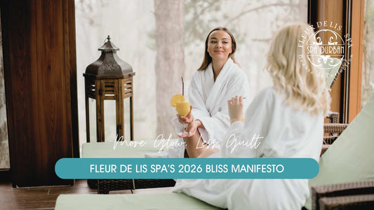 Two women enjoying drinks and conversation in spa robes at Fleur de Lis Spa, embracing relaxation and glow in line with Fleur de Lis Spa’s 2026 bliss manifesto